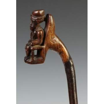 Carved Cane w/Seated Gentleman, Coat & Hat 