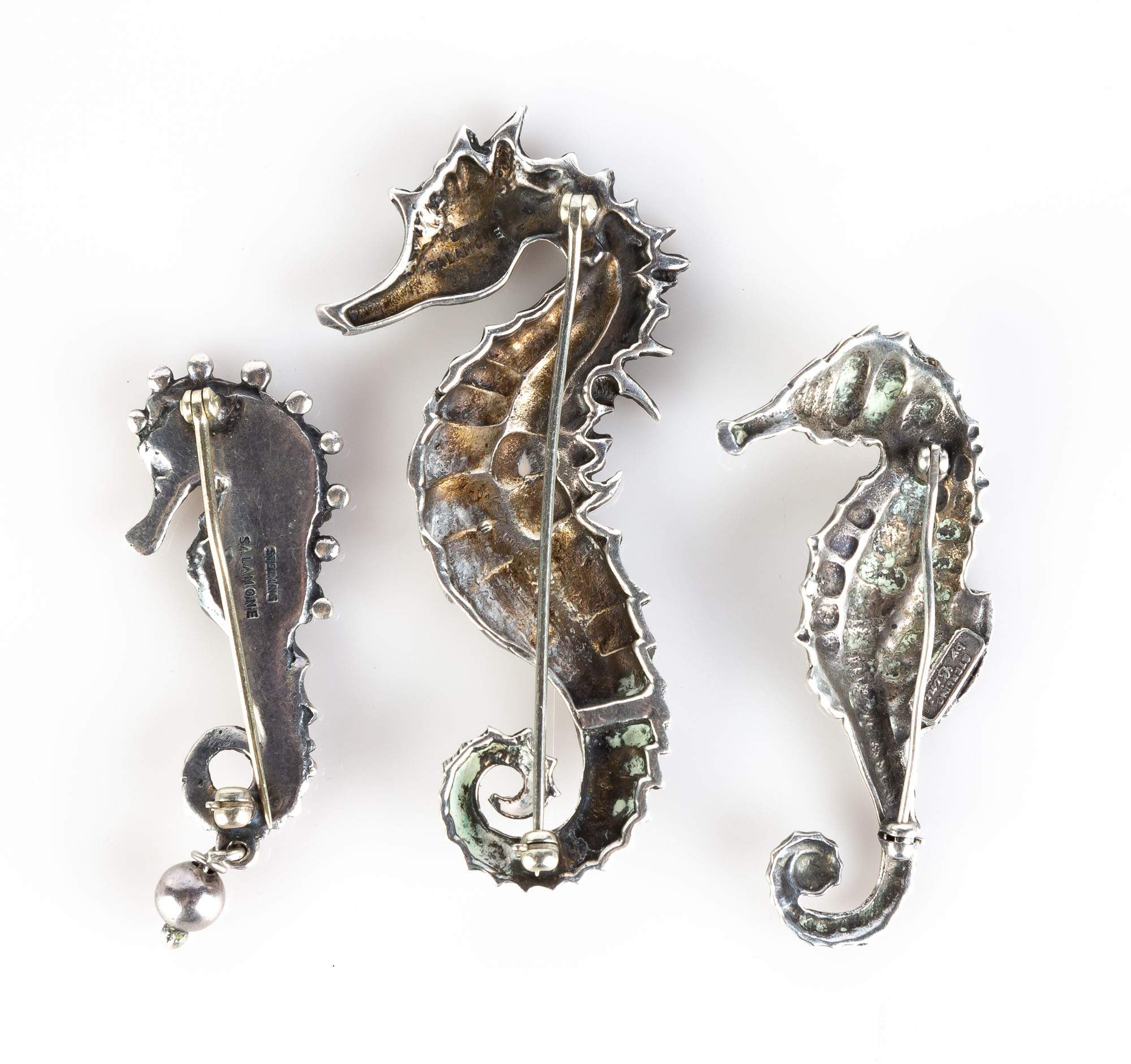 Three Sterling Seahorse Pins | Cottone Auctions