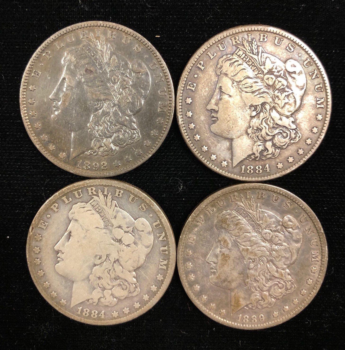 Four Liberty Head Silver Dollars | Cottone Auctions